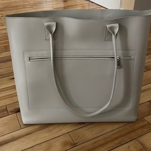 Genuine leather  Great laptop bag for someone on the go. Beautiful soft leather